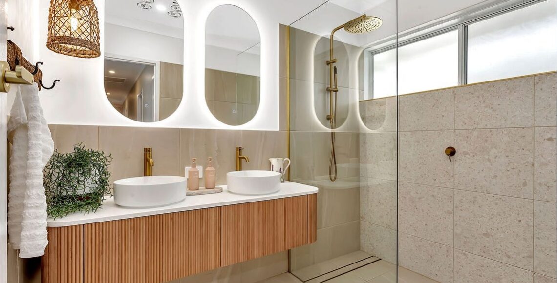 Renovated main bathroom with a fluted timber double vanity, brass tapware and walk-in shower