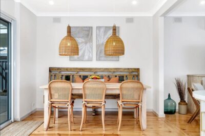 Port Noarlunga South dining room renovation Dining room with rattan pendant lighting and restored hardwood flooring