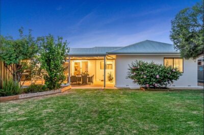 Port Noarlunga South home renovation, rear exterior Rear exterior of a renovated Port Noarlunga South home at dusk with new roofing