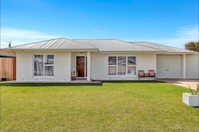 Port Noarlunga South home renovation, street view Renovated Port Noarlunga South home with a new roof and rendered white exterior