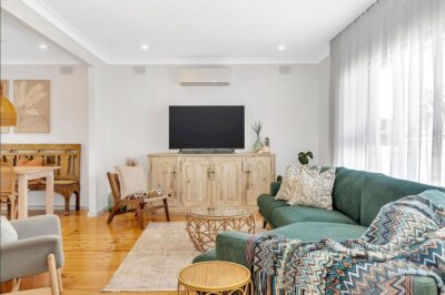 Port Noarlunga South living room renovation Renovated living room with polished hardwood floors and fresh interior painting